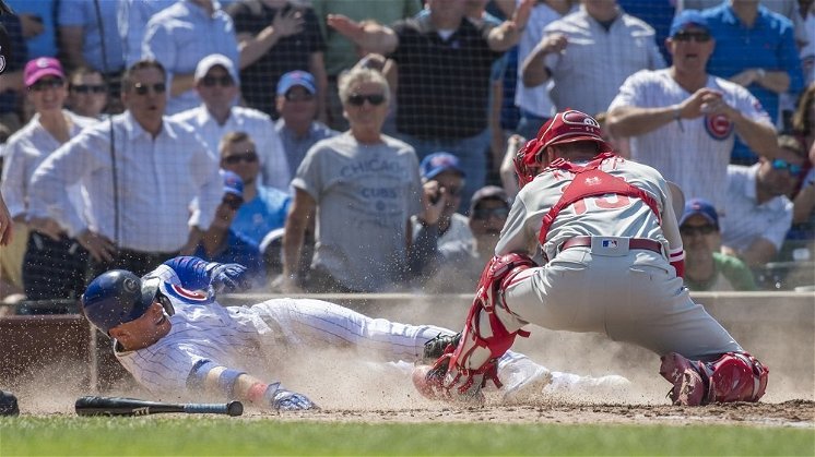 Following a video review, Albert Almora, Jr., was deemed to have been obstructed on what ended up being the winning play for the Cubs. (Photo Credit: Patrick Gorski-USA TODAY Sports)