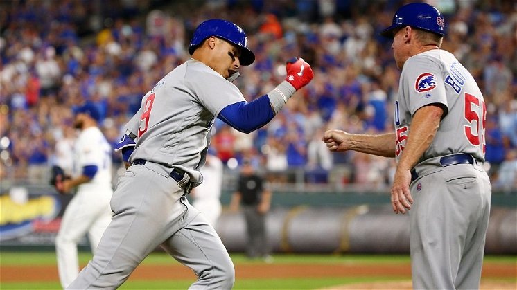 Led by Baez, Cubs overcome rain to dethrone Royals