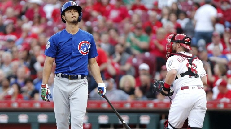 Cubs lose late lead, fall to Reds in extras