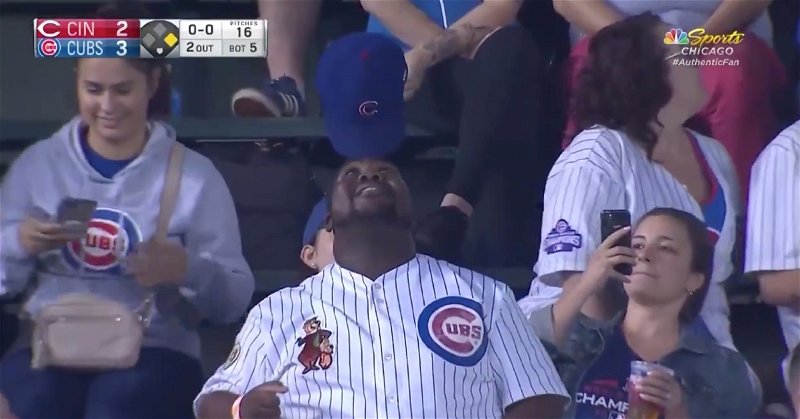 Chicago Cubs superfan Yogi was interviewed in the stands after performing his signature hat-balancing act at Wrigley Field.