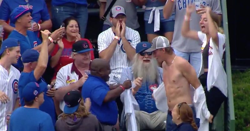 A disloyal St. Louis fan discarded his Cardinals jersey for a Cubs jersey after catching a home run hit by a Cubs player at Wrigley Field.