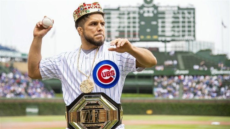 UFC flyweight champion Henry Cejudo donned plenty of bling while throwing out the first pitch. (Credit: Noah K. Murray-USA TODAY Sports)