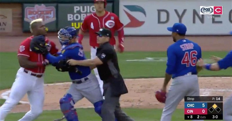 Yasiel Puig had to be stopped when charging toward Pedro Strop following a hit by pitch.