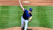 Cubs place reliever on IL, call up righty pitcher