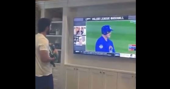 Kris Bryant showing his baby boy how the Cubbies won it all in 2016