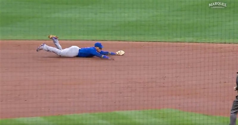 Cubs shortstop Javier Baez laid out and made a tremendous diving stop before flipping the ball to second base.