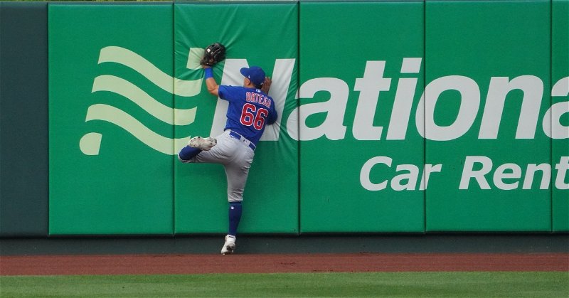 Rafael Ortega managed to hang onto the baseball after crashing into the center field wall. (Credit: @WatchMarquee on Twitter)