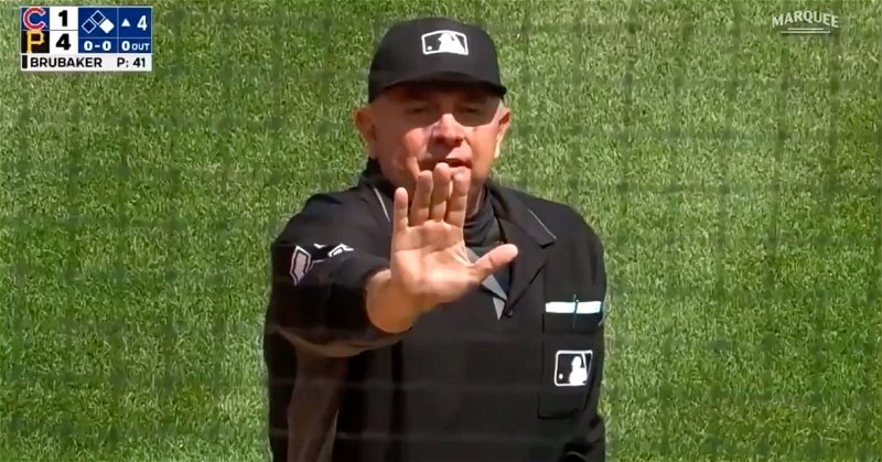 Umpire Greg Gibson threw Cubs catching coach Mike Borzello out of Sunday's game.