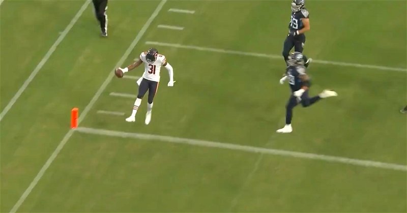 Bears cornerback Tre Roberson ran, untouched, into the end zone after picking off a pass against the Titans.