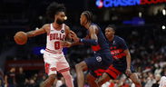 Bulls roll past Wizards in group play