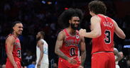 Bulls catch fire late to top Heat