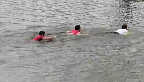 Seniors swim the moat after last practice