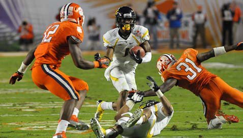 Mountaineers get offensive in Orange Bowl rout of Tigers 
