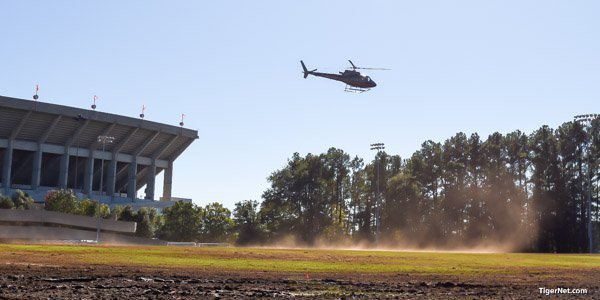 A helicopter tries to dry one of the grass lots a few weeks ago 