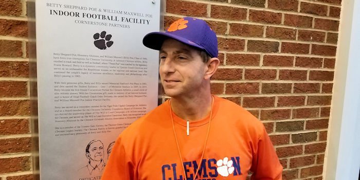 Swinney stands in front of the plaque Wednesday 