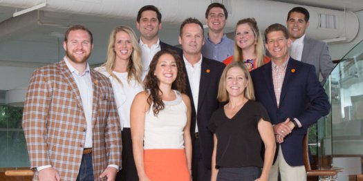 Eric Mac Lain (left front) is part of the new sports marketing team 