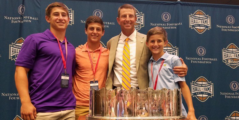 Clemson coach Dabo Swinney with sons (l-r) Will, Drew and Clay earlier this year. Dabo says family is what kept him in the coaching business. 