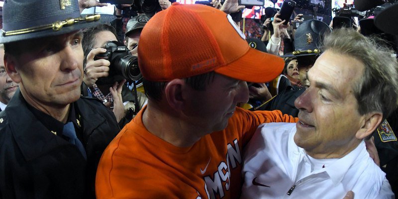 Swinney is congratulated by Saban after Clemson's 35-31 win in the title game (Photo by Kirby Lee, USAT)