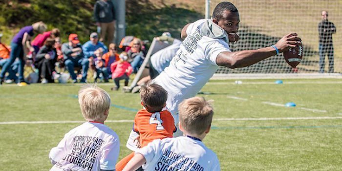 Watson working with the kids at a previous camp