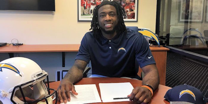 Williams signed his contract on Thursday