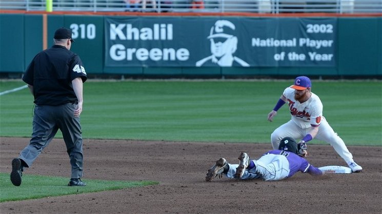 Grayson Byrd tags out a Furman baserunner