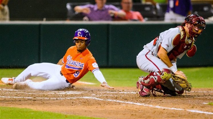 Jordan Greene slides in for Clemson's second run of the night (Photo by David Grooms)