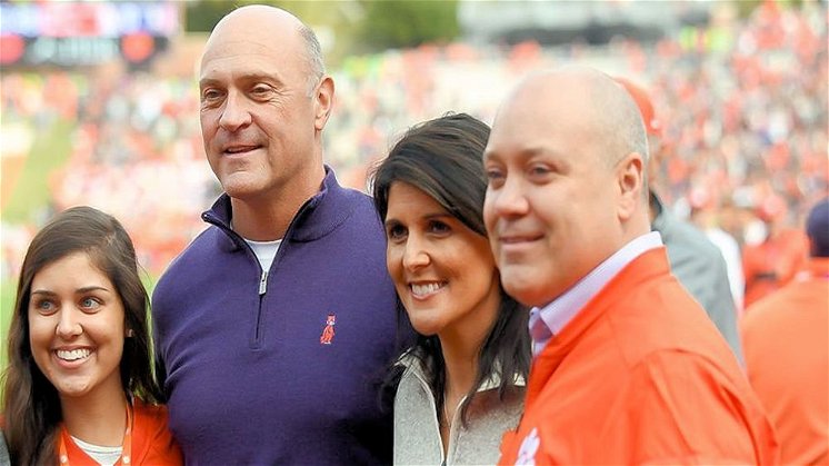Nikki Haley with her family and President Clements during a football game
