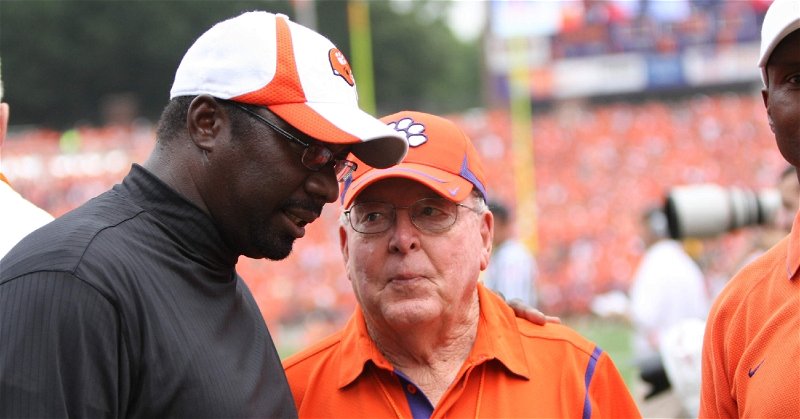Hoover (right) speaks with Homer Jordan at a Clemson game. (Photo courtesy Clemson Athletics)